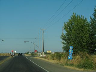 Following the section line, CR E6 crosses agricultural areas east to County Route E7 (Road 98).
