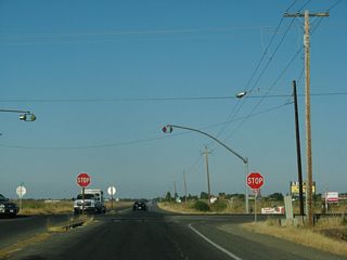 Yolo County Route E-7 (Pedrick Road) heads south from the four-way stop with CR E6 (Road 31) to Interstate 80 at Exit 67 and north to SR 16 in Woodland.