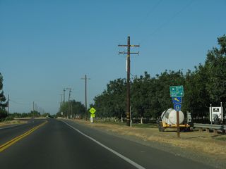 Yolo County Route E-6 shifts northward off Russell Boulevard onto Road 93A across parallel Dry Slough. Russell Boulevard (Road 32) follows a stair-stepped course east to southern Davis.