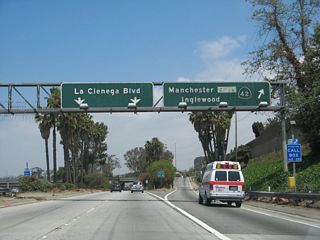 The off-ramp eventually splits between La Cienega Boulevard and Manchester Boulevard (Exit 47, former California 42).