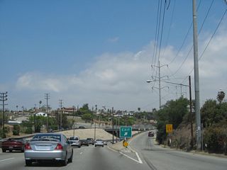 Northbound La Cienega Boulevard meets the off-ramp to Slauson Avenue, which is the planned alignment for California 90 should it ever be extended east of the Marina Freeway segment.
