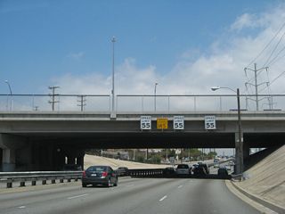 Somewhat unusual was an experiment to have different speed limits in each lane of La Cienega Boulevard, using the concept that the left lane would have faster vehicles and the right lane would have slower vehicles. The experiment called for the left lane to have a faster speed limit than the right lane, and speed limit signs were posted on overpasses along La Cienega Boulevard back when the study was conducted. As one could imagine, the various speed limits did not work, and now there are three speed limit signs, each with the same speed limit, posted over each lane of northbound La Cienega at Slauson Avenue.