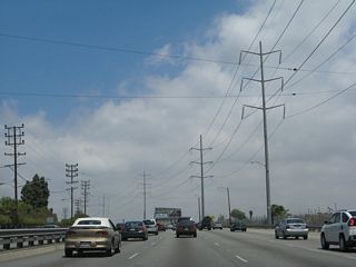 As a new lane joins northbound La Cienega Boulevard after the Slauson Avenue interchange, the freeway now has four northbound lanes ... but not for long.