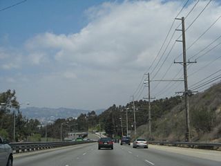 This view looks north along La Cienega Boulevard in the Baldwin Hills toward the Kenneth Hahn State Recreation Area Drive interchange.