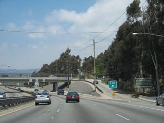 Northbound La Cienega Boulevard meets the off-ramp to Kenneth Hahn State Recreation Area Drive in Baldwin Hills.