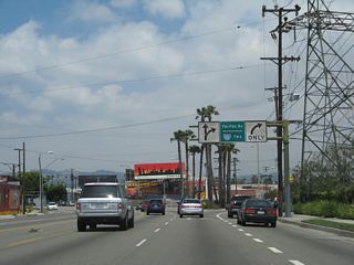 After passing the intersection with Jefferson Boulevard, northbound La Cienega Boulevard prepares to split with Fairfax Avenue. Stay left for La Cienega Boulevard to California 187 (Venice Boulevard) or right for Fairfax Avenue to Interstate 10 (Santa Monica Freeway).