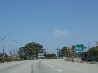 The off-ramp from Harbor Scenic Drive north to Queensway Drive loops makes a U-turn back toward Pier H.