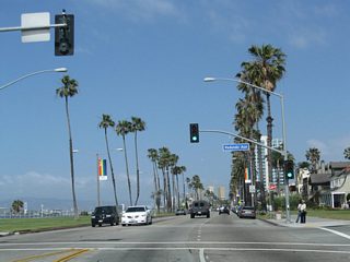 Approaching Redondo Avenue, the Pacific Ocean and Junipero Beach come into view on the south side of Ocean Boulevard.