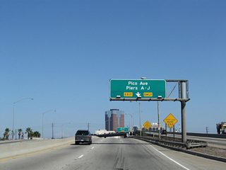 After Interstate 710 shifts onto the Long Beach Freeway north, Ocean Boulevard continues east as a short freeway that connects the Gerald Desmond Bridge with Downtown Long Beach. The succeeding exit is for Pico Street and Piers A through J.