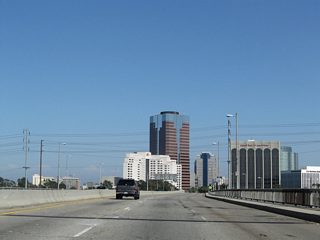 As the downtown Long Beach skyline comes into view, Ocean Boulevard passes over the Los Angeles River.