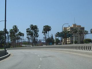 Beyond the Queensway Drive off-ramp, traffic quickly splits with ramps for Harbor Scenic Plaza and Harbor Plaza to the Port of Long Beach Piers F-G-H-J.