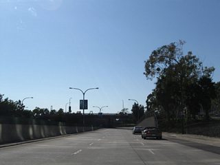 West from Queens Way, Shoreline Drive transitions to a freeway. Shoreline Drive is locally maintained by the Port or City of Long Beach, and not a part of Interstate 710.