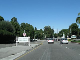 Northbound Crenshaw Boulevard approaches Palos Verdes Drive North, ahead on the right is the South Coast Botanic Garden.