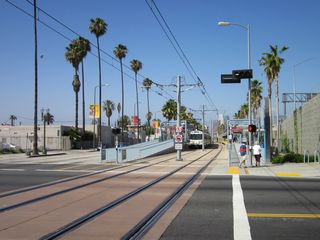 Near Interstate 110 (Harbor Freeway), this view looks north along Flower Street at the Expo Line station; the majority of this light rail line opened for use on April 28, 2012.