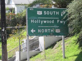 Southbound Glendale Boulevard approaches U.S. 101 (Hollywood Freeway). A graffiti-covered sign advises of the pending interchange. U.S. 101 travels north to Hollywood and south to Downtown Los Angeles.