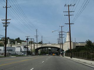 Riverside Drive approaches the arched Hyperion Avenue overpass. An on-ramp connects Riverside Drive to Interstate 5 (Golden State Freeway).
