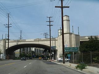 Riverside Drive approaches the arched Hyperion Avenue overpass. An on-ramp connects Riverside Drive to Interstate 5 (Golden State Freeway).