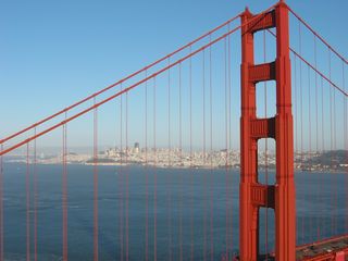 The Golden Gate Bridge, a suspension bridge painted primarily in the "international orange" color, is 8,981 feet long and has two prominent towers (each 500 feet tall above the roadway) to support the cables. Photo by Pete Sison.