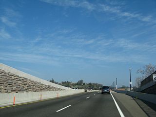 Traveling northeast on Folsom Boulevard is this interchange with Sutter Street just west of downtown Folsom after the Natoma Street intersection. Natoma Street east leads to the Folsom Lake Crossing near Folsom Dam.