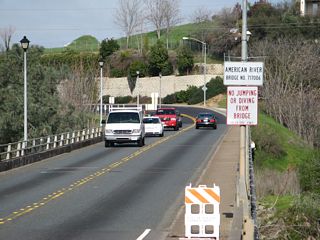 Northbound Greenback Lane leaves downtown Folsom and crosses the American River (Lake Natoma) on the Rainbow Bridge. It is not very common to see this bridge devoid of traffic!