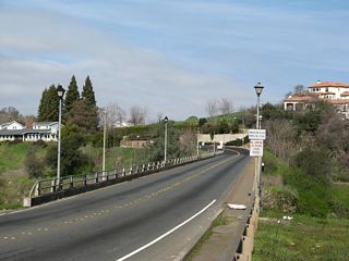 Northbound Greenback Lane leaves downtown Folsom and crosses the American River (Lake Natoma) on the Rainbow Bridge. It is not very common to see this bridge devoid of traffic!
