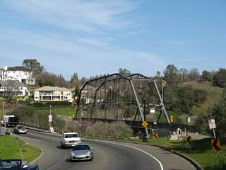 Traveling north on Greenback Lane (which changes into Riley Street south of Scott Street in downtown Folsom), the historic truss bridge comes into view prior to crossing the Rainbow Bridge.