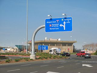 Leaving Sacramento International Airport - Terminal A ahead of the short expressway spur leading to Interstate 5.