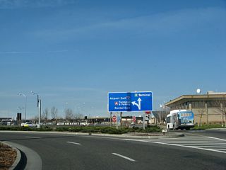 Leaving Sacramento International Airport - Terminal A ahead of the short expressway spur leading to Interstate 5.