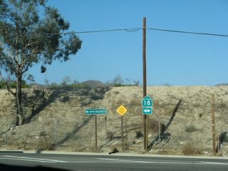 The former north end of SR 18 Business at SR 18 (Waterman Avenue). SR 18 travels north from San Bernardino to mountain resorts. The SR 18 shield was removed by 2011.