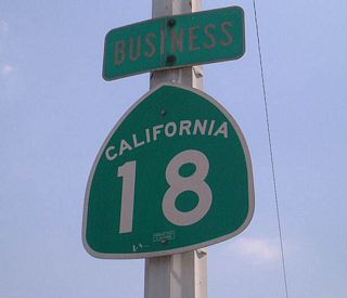 The former confirming marker for SR 18 Business posted east of SR 259 in San Bernardino. Highland Avenue was also once part of SR 30 Business.