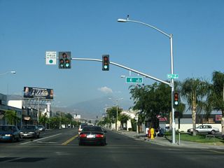 Highland Avenue east at E Street, which is former SR 206. E Street leads north to Kendall Drive, which angles northwest past Shandin Hills to eventually meet I-215 along what was U.S. 66 Business. SR 206 was the designation of the route after the U.S. designation was removed, but before the state transferred maintenance to the city. Southward, H Street heads into Downtown San Bernardino.