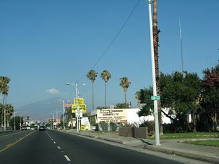A business banner without shields for SR 18 or SR 30 appeared on this street light pole after G Street.