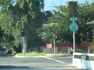 Removed after 2011, this badly faded and graffiti covered SR 18 Business shield was posted along northbound Sierra Way at 30th Street.