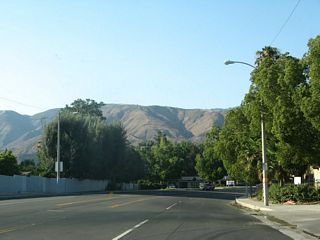 Sierra Way curves northeast toward SR 18 (Waterman Avenue) beyond 44th Street.