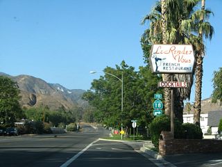 SR 18 Business turned east from Sierra Way north along 48th Street. Sierra Way dead ends north of the six-point intersection with Leroy Street and 49th Street without access to SR 18. The SR 18 trailblazer here was removed by 2023.
