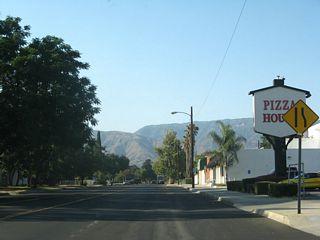 Sierra Way (old SR 18 Business) leading north from the commercial strip at Highland Avenue (old SR 30 Business).