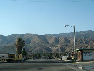 Sierra Way enters a business district north at Ralston Avenue.