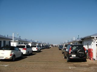 Cottages initially line Crystal Pier before the structure narrows into a more traditional fishing pier.