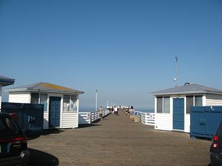 Crystal Pier is open for public use from sunrise to sunset; visitors may stay overnight in one of the Crystal Pier Hotel's famous cottages that sit over the beach and ocean.