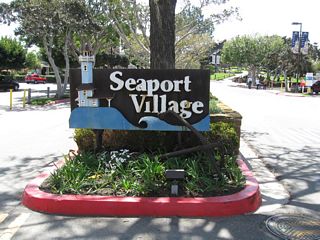 At the south end of Kettner Boulevard and Pacific Highway is Seaport Village, a notable tourist attraction that includes restaurants, stores, and bayfront views. This sign is located on Kettner Boulevard.