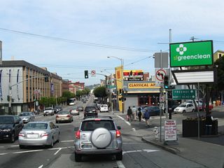 A major intersection along Bay Street is with Columbus Avenue and Jones Street in North Beach. This (basically) six-way intersection allows for a turn onto Columbus Avenue southeast toward the Financial District. Jones Street travels north-south. Note the signage for "freeway" and "North Beach." A defunct Tower Records store is notable at this intersection.