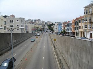 Now looking west from Hyde Street, Broadway Street passes under Hyde Street and approaches the signalized intersection with north-south Larkin Street. From there west, Broadway Street continues west toward Van Ness Avenue (U.S. 101, two blocks west of Larkin Street) and thence onward through Pacific Heights, ending at the Presidio border.