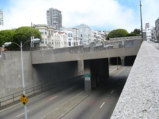 These pictures show the Broadway Tunnel as seen from the off-ramp connecting eastbound Broadway Street to Hyde Street. The Hyde Street overpass is a typical 1950s-era overpass structure, and Broadway feels briefly like an urban freeway before entering the tunnel. Note the vertical clearance for the tunnel is 13 feet, 6 inches.