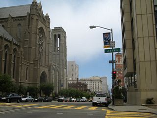 Eastbound California Street meets Jones Street, which is one-way southbound. Soaring Grace Cathedral is located on the south side of Jones Street at the peak of Nob Hill. From here, we descend toward the bay.