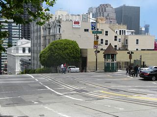 At Grace Cathedral, California Street drops from Nob Hill east into downtown.