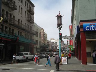 Northbound Grant Street meets Jackson Street at this intersection. Note the street lights that are designed to look like paper lanterns and Chinese language used for each road name.