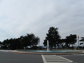 Coming into Lincoln Park via 34th Avenue, the Lincoln Highway marker stands next to a bus stop next to the Palace of the Legion of Honor.