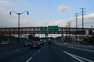 A slip ramp joins Kenilworth Avenue north with D.C. 295 ahead of another slip ramp for the exit to Quarles Street.