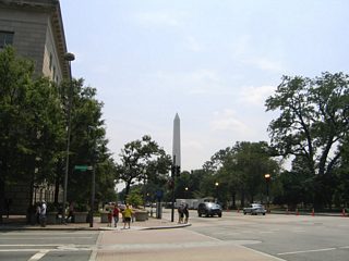 Looking south at 15th Street NW at Pennsylvania Avenue NW with Washington Monument rising on the horizon.