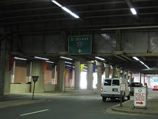 An original guide sign over L'Enfant Promenade north still eludes to Interstate 95 District of Columbia via D Street east. Interstate 95 was signed along what is now Interstate 395 until 1977.